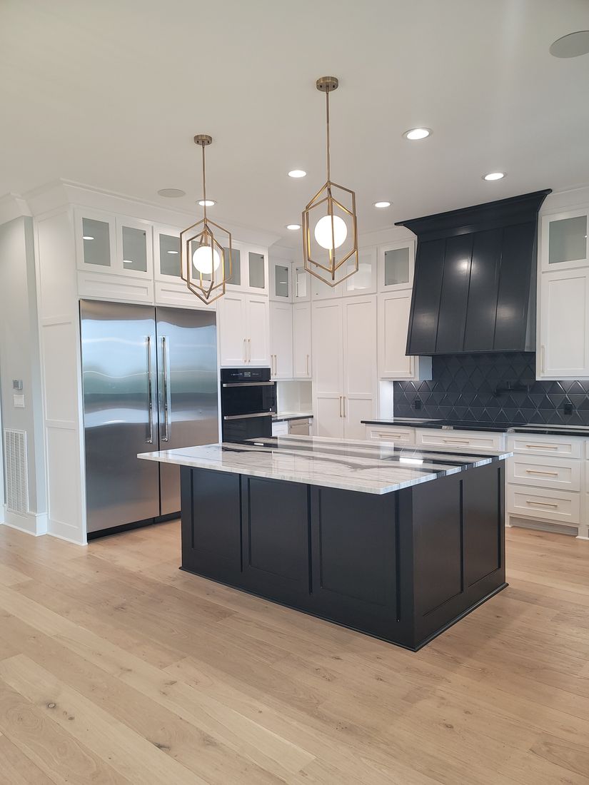 Completed Custom Estate Residence Waterfall Quartzite Island and Custom Black Hood