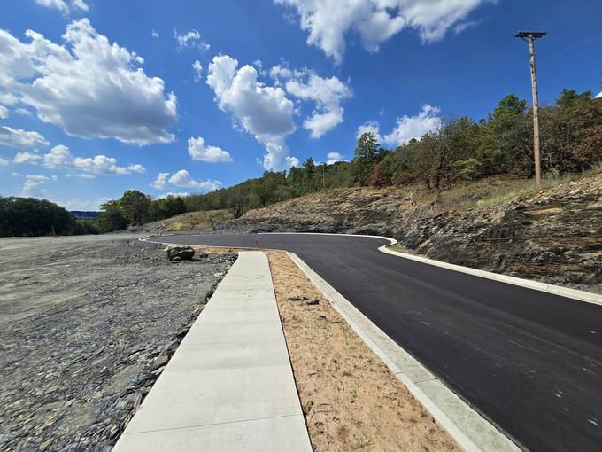 Underground Electric and Fiber Pedestals Along Completed Sidewalk and Bluff Cut