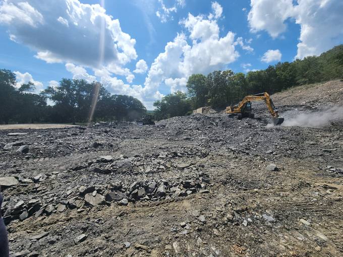 Heavy CAT Excavator Cutting Solid Shale and Sandstone Bedrock